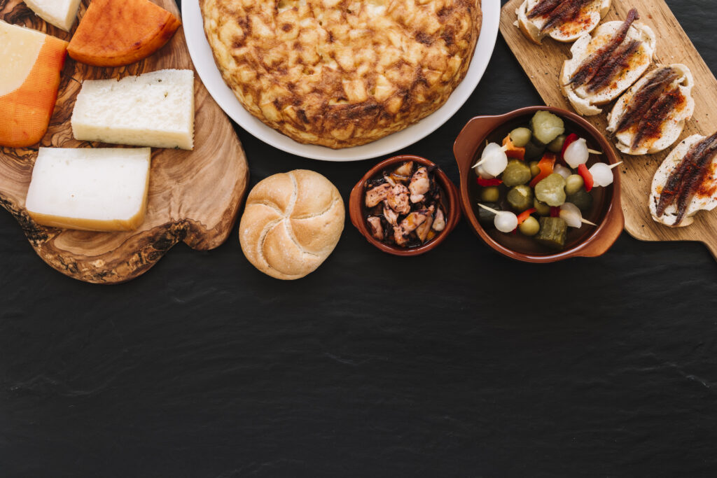 A dining table with various tapas dishes