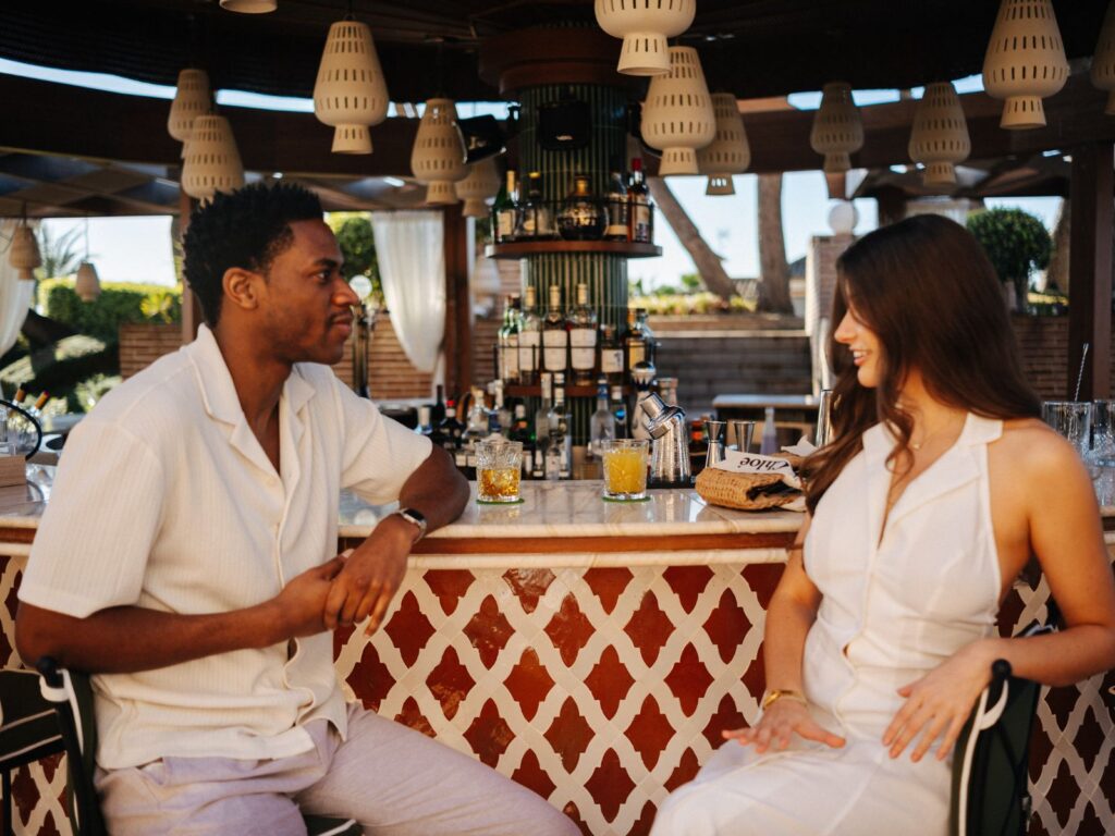 couple at an outdoor bar in a hotel