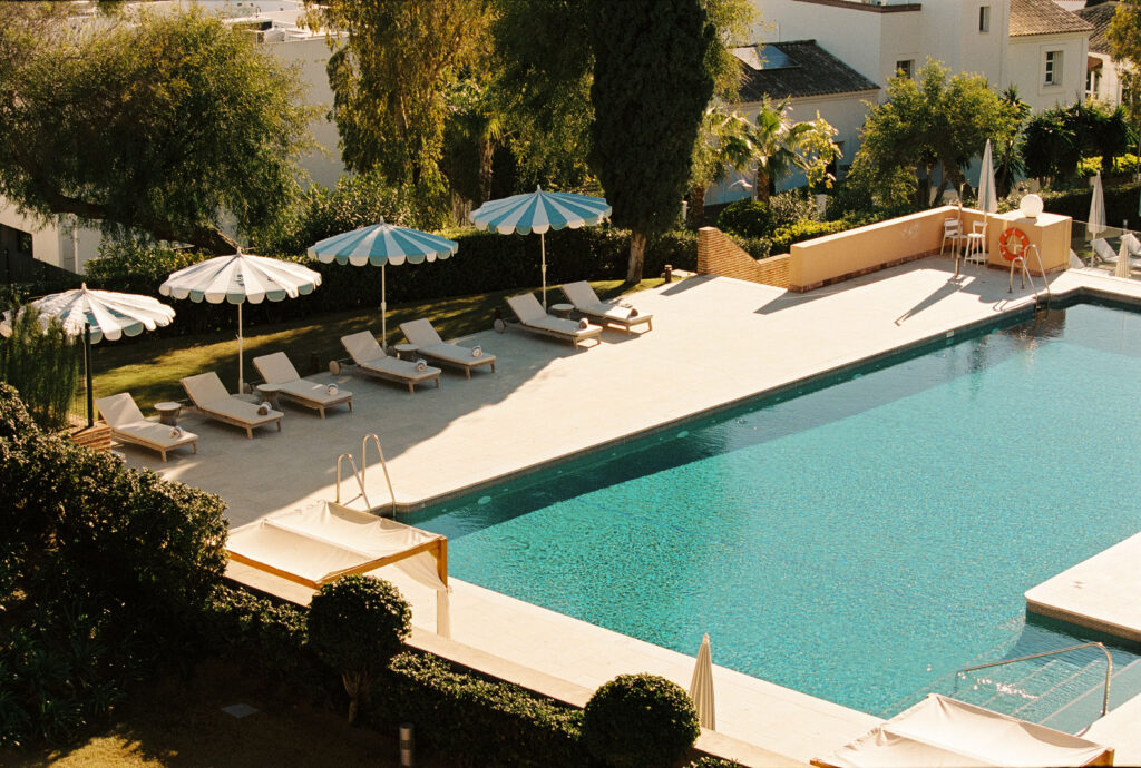pool and loungers in a hotel