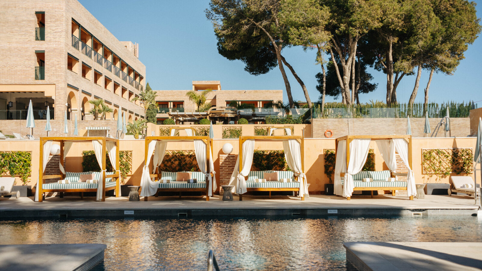 pool and cabanas in a hotel