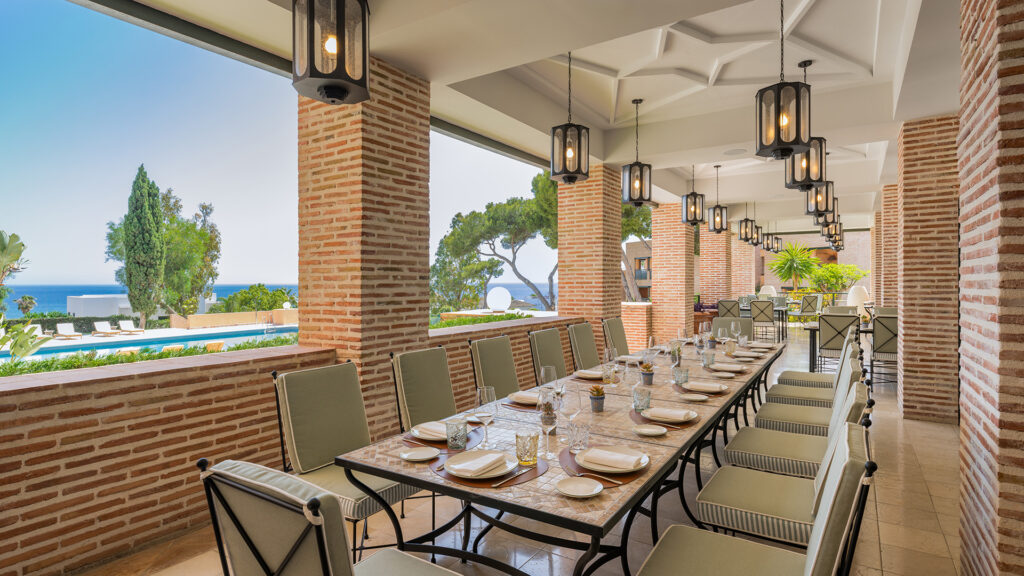 long dining table by the pool